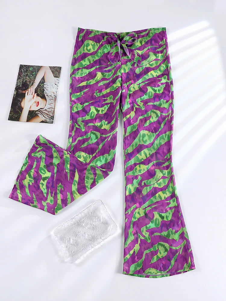 Purple and green patterned pants on a white background