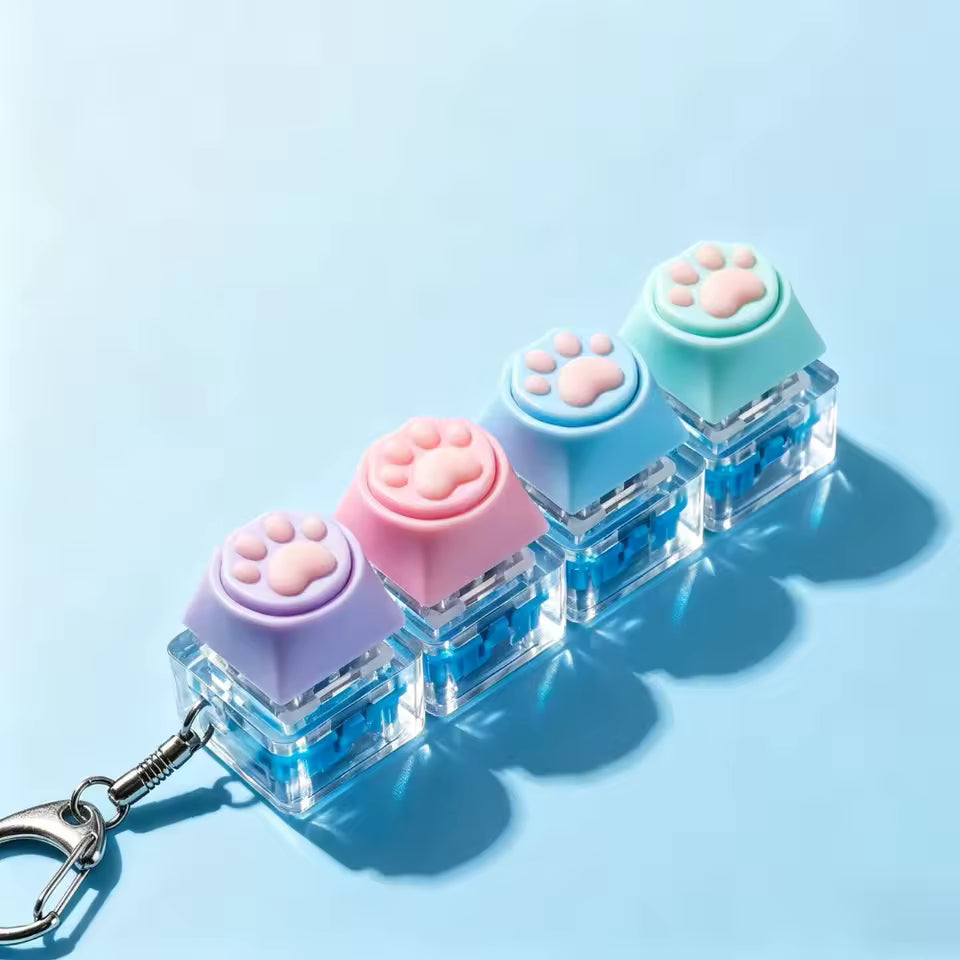 Colorful keychain with paw-shaped ends on a light blue background